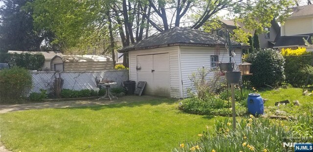 view of shed with fence