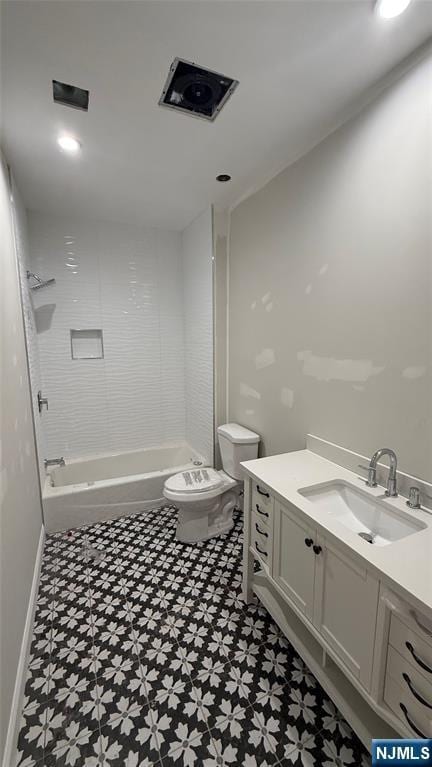 bathroom with washtub / shower combination, vanity, toilet, and tile patterned floors