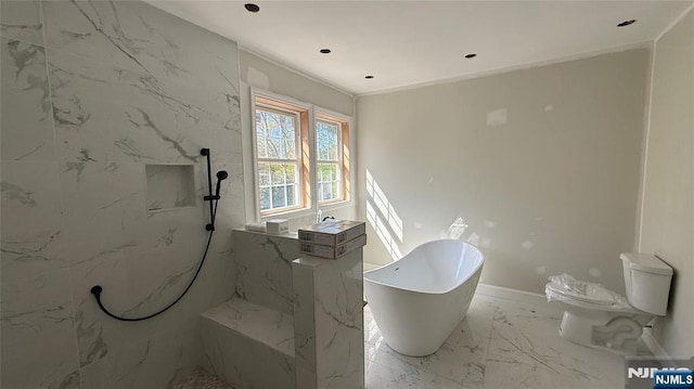 bathroom with a freestanding tub, toilet, marble finish floor, and a marble finish shower