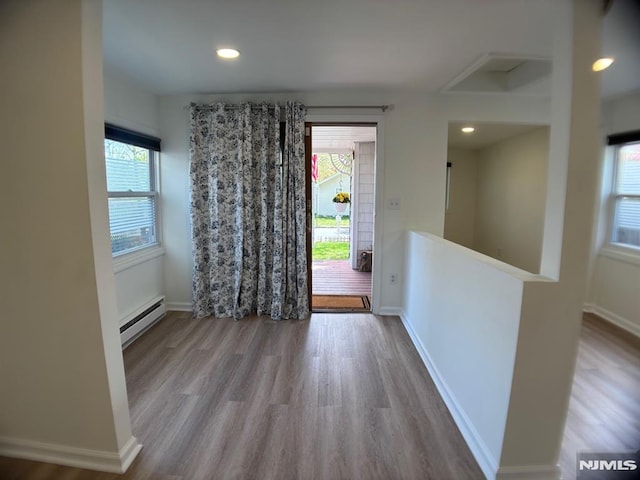 46 Park Dr, Oakland, NJ 07436 - foyer with baseboards, wood finished floors, and baseboard heating