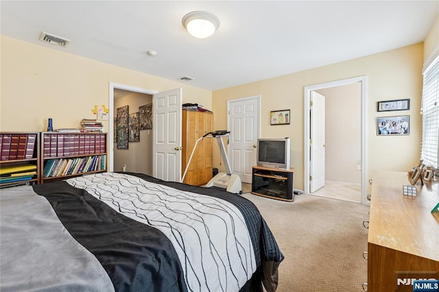 carpeted bedroom with visible vents