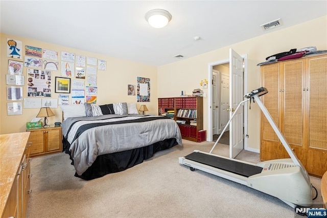 carpeted bedroom with visible vents