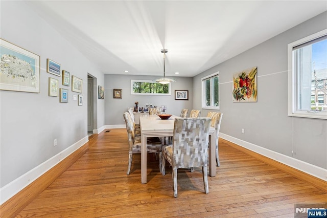 dining space featuring light wood-type flooring, recessed lighting, and baseboards