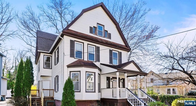 view of front of home featuring a shingled roof