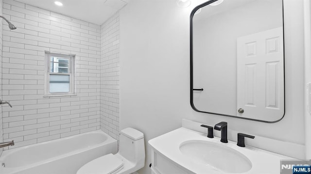 full bathroom featuring toilet, tub / shower combination, and vanity
