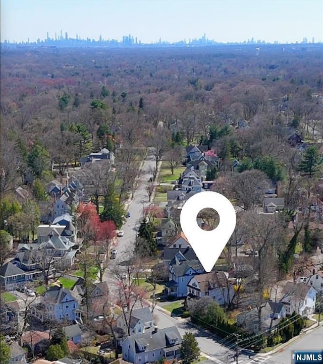 aerial view featuring a residential view and a forest view