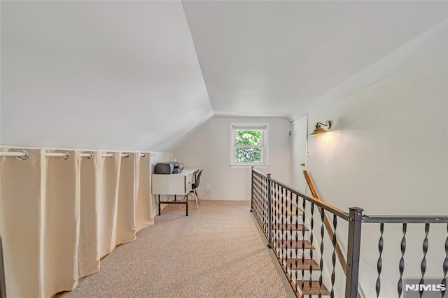 bonus room featuring carpet flooring and vaulted ceiling
