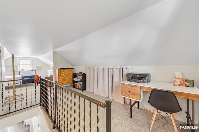 office area featuring carpet floors and vaulted ceiling