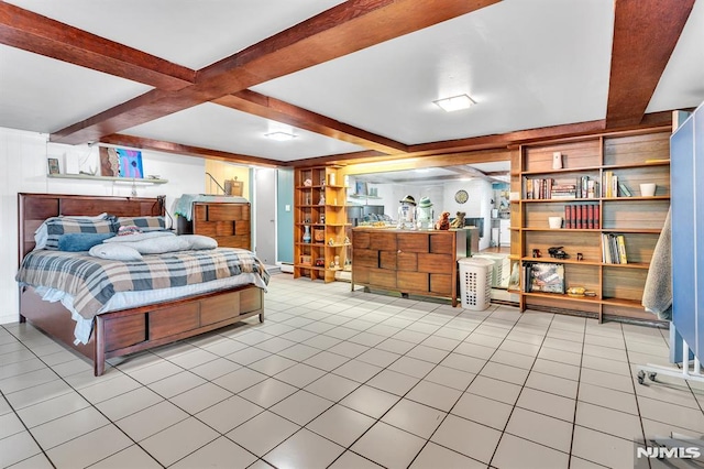 tiled bedroom featuring beam ceiling