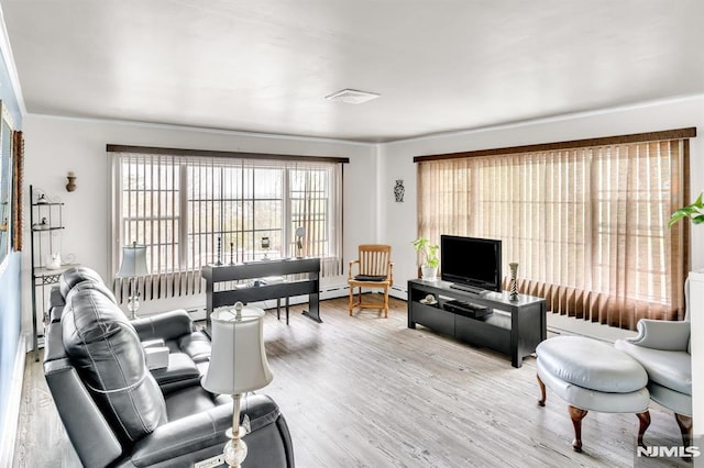 living room with visible vents and wood finished floors