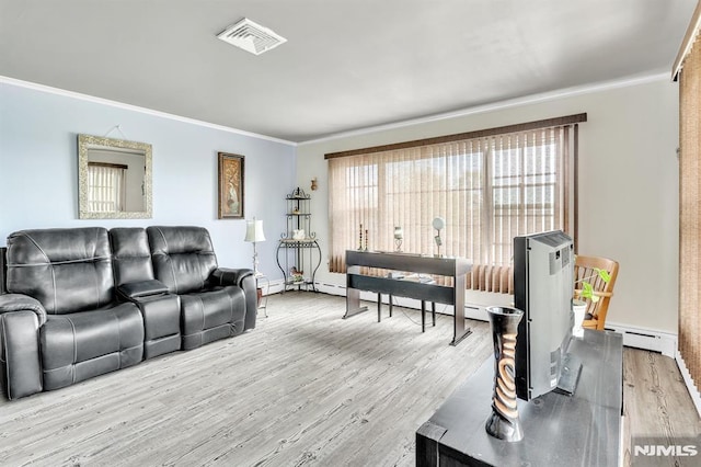living room with crown molding, a baseboard heating unit, wood finished floors, and visible vents