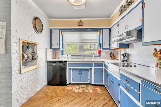 kitchen featuring blue cabinets, dishwasher, a sink, light countertops, and under cabinet range hood