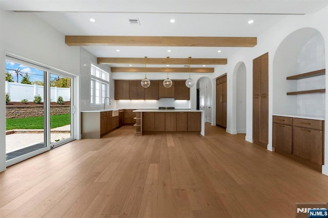 229 Bogert Pl, Paramus, NJ 07652 - kitchen with light countertops, open shelves, and light wood-style flooring