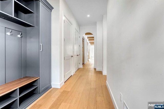 229 Bogert Pl, Paramus, NJ 07652 - mudroom with light wood-style floors, arched walkways, baseboards, and recessed lighting