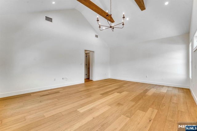 229 Bogert Pl, Paramus, NJ 07652 - empty room featuring light wood-style floors, high vaulted ceiling, a notable chandelier, and visible vents