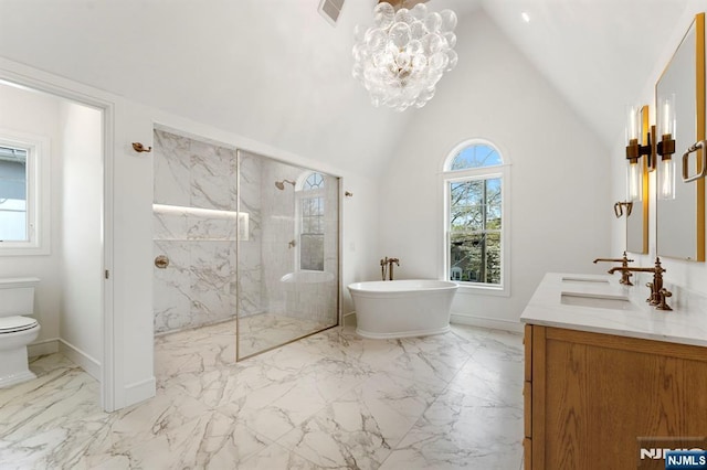 229 Bogert Pl, Paramus, NJ 07652 - full bathroom featuring vanity, a marble finish shower, marble finish floor, vaulted ceiling, and a soaking tub
