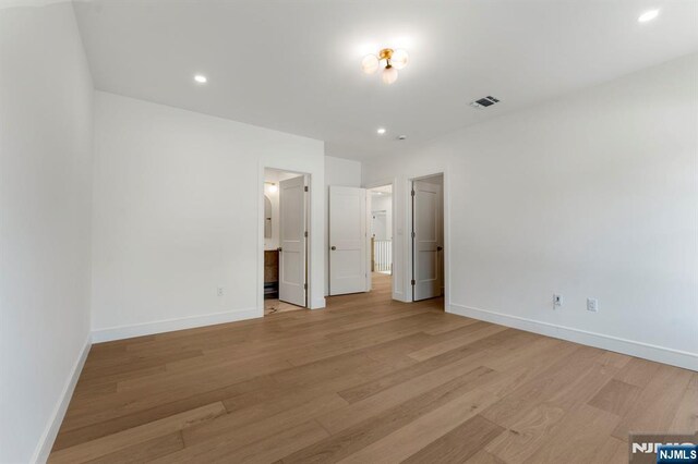 229 Bogert Pl, Paramus, NJ 07652 - unfurnished bedroom featuring recessed lighting, baseboards, visible vents, and light wood finished floors