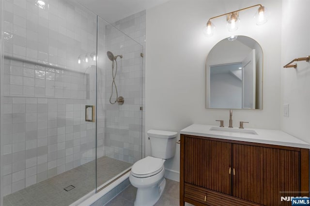 229 Bogert Pl, Paramus, NJ 07652 - full bathroom featuring toilet, tile patterned floors, a shower stall, and vanity