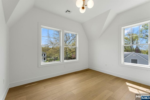 229 Bogert Pl, Paramus, NJ 07652 - additional living space featuring visible vents, light wood finished floors, plenty of natural light, and lofted ceiling