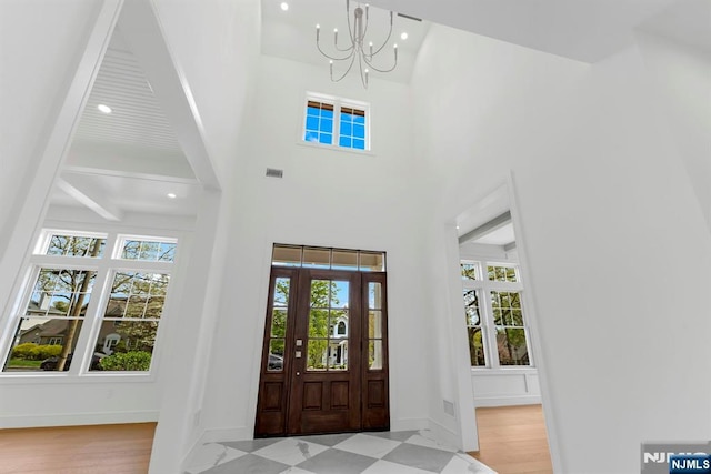 229 Bogert Pl, Paramus, NJ 07652 - foyer with a notable chandelier, recessed lighting, baseboards, a towering ceiling, and visible vents