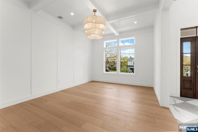229 Bogert Pl, Paramus, NJ 07652 - interior space with plenty of natural light, light wood finished floors, beam ceiling, and a notable chandelier