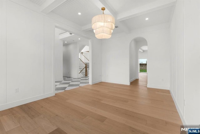 229 Bogert Pl, Paramus, NJ 07652 - interior space with recessed lighting, arched walkways, light wood finished floors, and beam ceiling