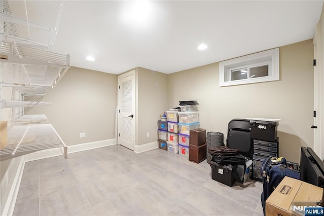 interior space featuring recessed lighting and baseboards