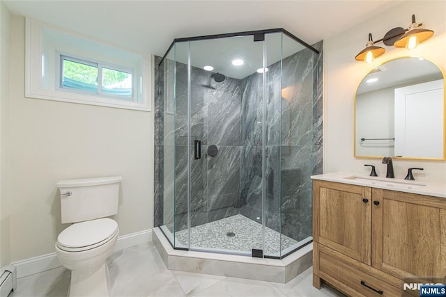 bathroom featuring vanity, marble finish floor, toilet, baseboards, and a baseboard heating unit