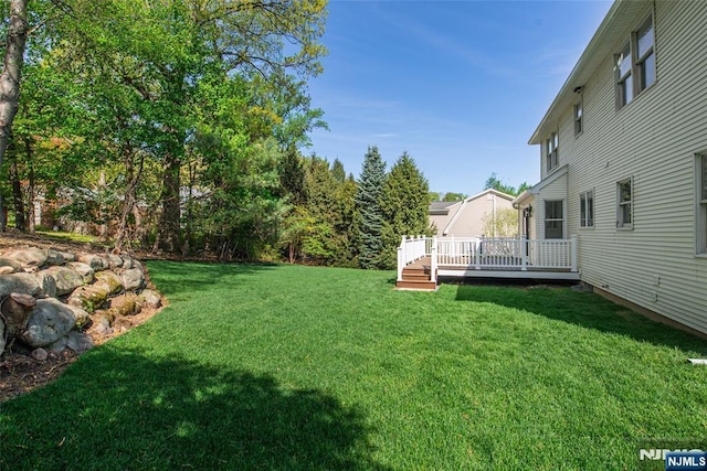 view of yard featuring a deck