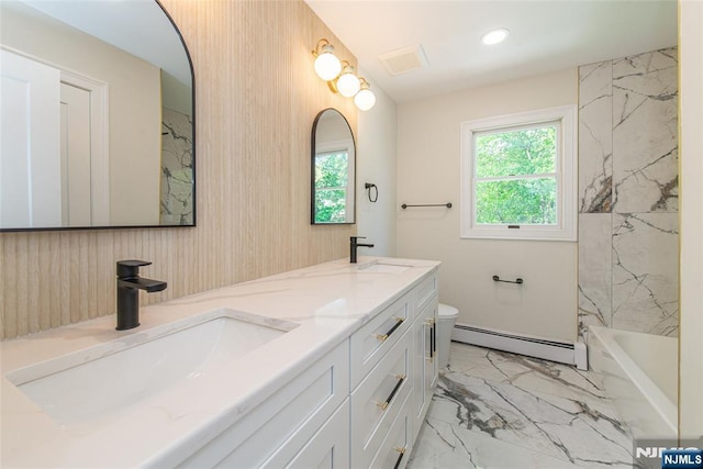 full bath featuring a sink, marble finish floor, a baseboard heating unit, and toilet