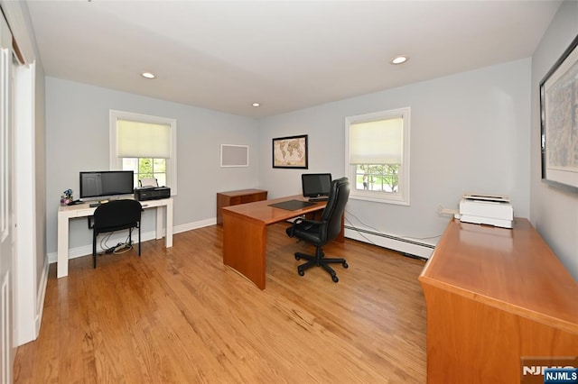 office space featuring recessed lighting, light wood-type flooring, a wealth of natural light, and a baseboard radiator