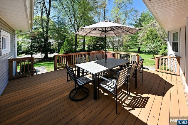 wooden deck with outdoor dining space