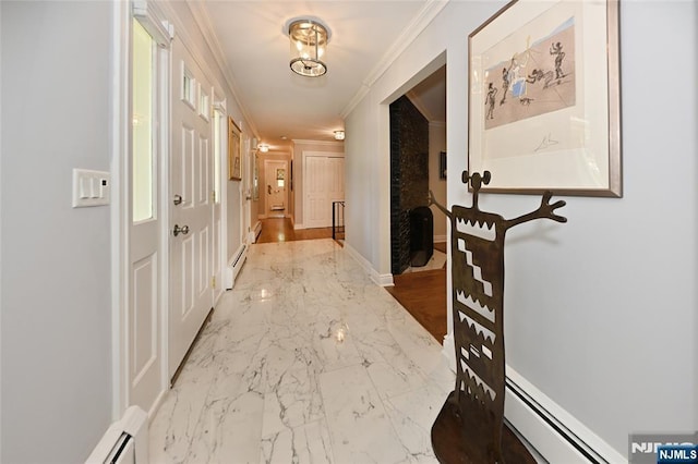corridor with baseboards, ornamental molding, baseboard heating, and marble finish floor