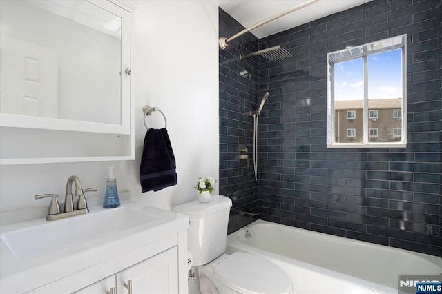 full bathroom featuring toilet,  shower combination, and vanity