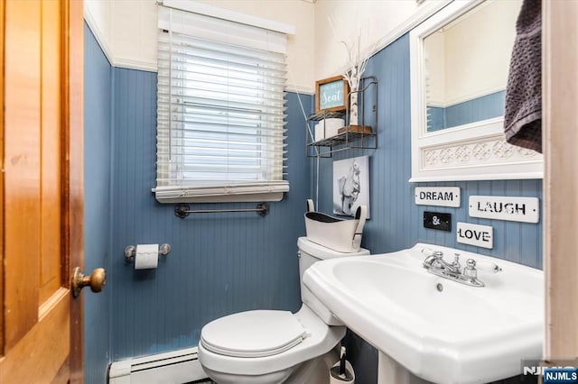 444 Washington St, Carlstadt, NJ 07072 - half bathroom featuring a baseboard heating unit, toilet, and a sink