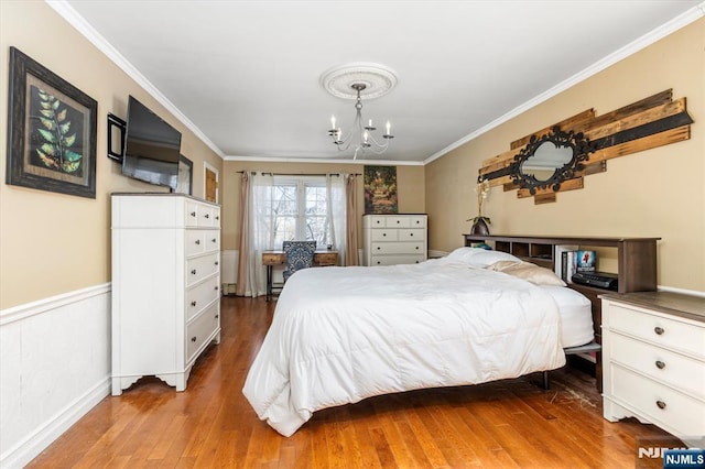 444 Washington St, Carlstadt, NJ 07072 - bedroom featuring a chandelier, ornamental molding, and hardwood / wood-style floors