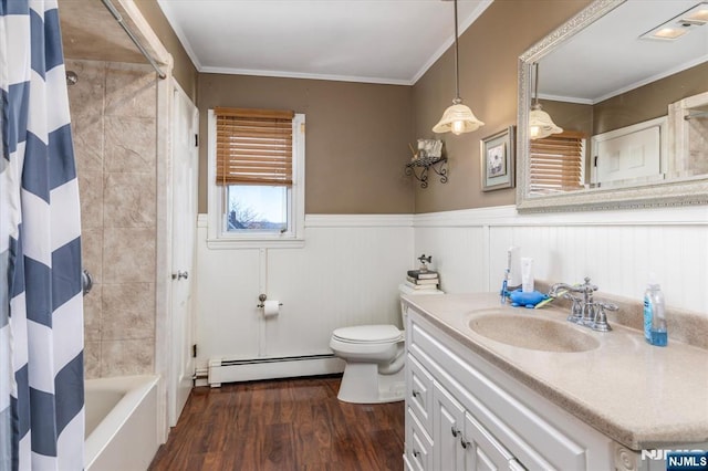 444 Washington St, Carlstadt, NJ 07072 - bathroom with a baseboard radiator, wood finished floors, toilet, vanity, and wainscoting