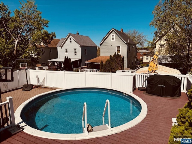 444 Washington St, Carlstadt, NJ 07072 - view of swimming pool featuring a wooden deck and a residential view