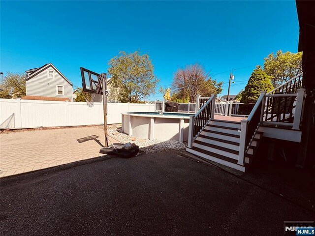 444 Washington St, Carlstadt, NJ 07072 - fenced backyard featuring stairs and a deck