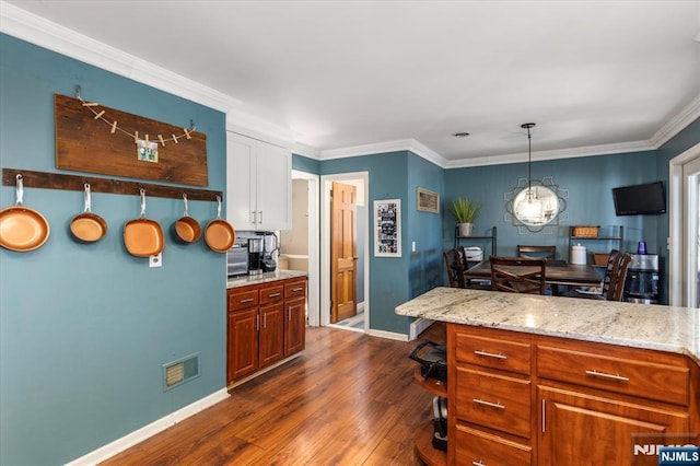 444 Washington St, Carlstadt, NJ 07072 - kitchen with baseboards, dark wood-style flooring, white cabinetry, crown molding, and light stone countertops