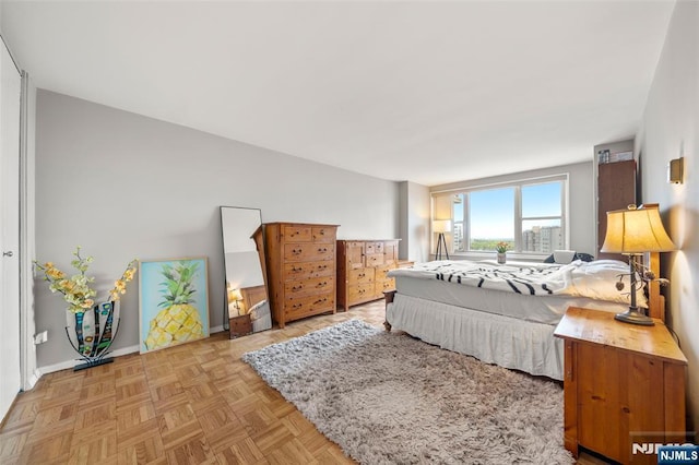 bedroom featuring baseboards