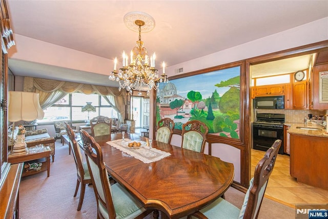 dining area with an inviting chandelier, light carpet, and visible vents