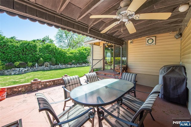 view of patio featuring outdoor dining area and ceiling fan