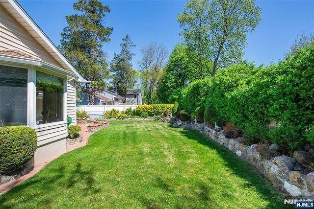 view of yard featuring fence