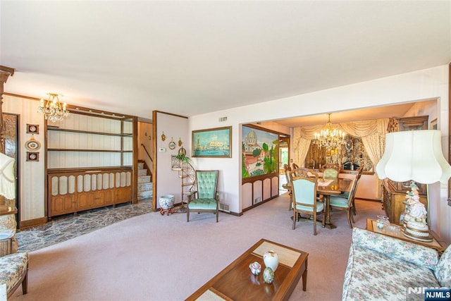 living area with stairway, carpet floors, baseboards, and a notable chandelier