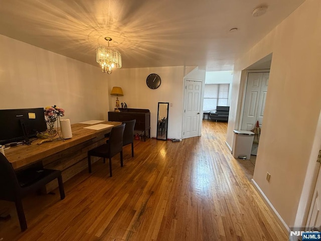 dining room featuring a chandelier and wood finished floors