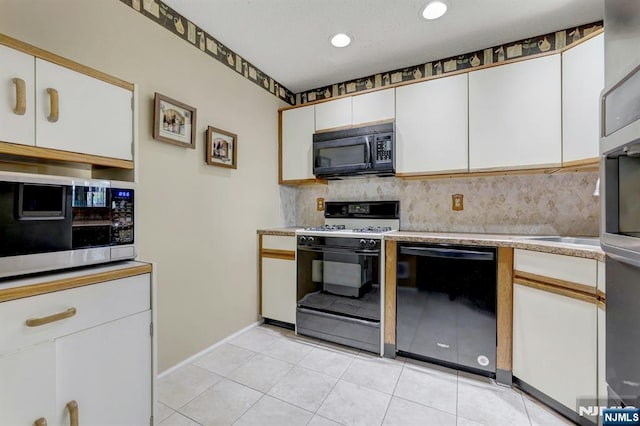 kitchen with baseboards, light countertops, white cabinets, tasteful backsplash, and black appliances