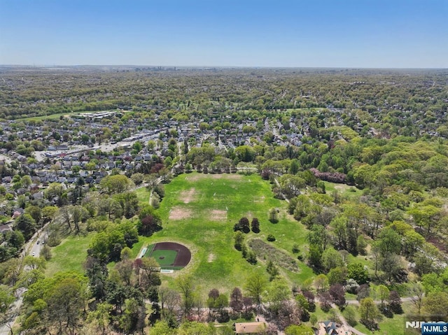 bird's eye view featuring a wooded view