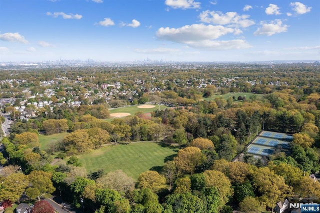 birds eye view of property with view of golf course