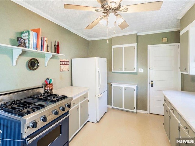 kitchen featuring freestanding refrigerator, open shelves, light countertops, range with gas cooktop, and a ceiling fan
